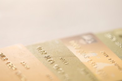 Photo of Many credit cards on gray background, closeup. Space for text