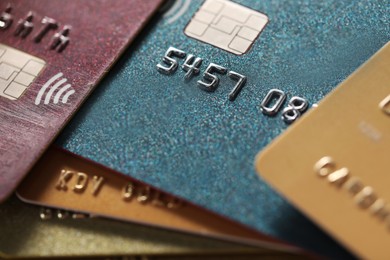 Different plastic credit cards as background, macro view