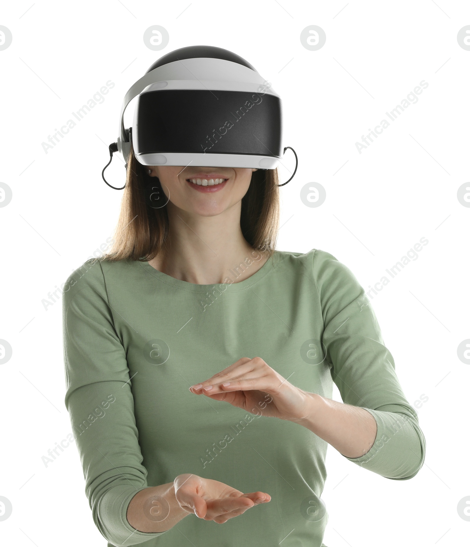 Photo of Smiling woman using virtual reality headset on white background