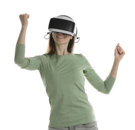 Smiling woman using virtual reality headset on white background