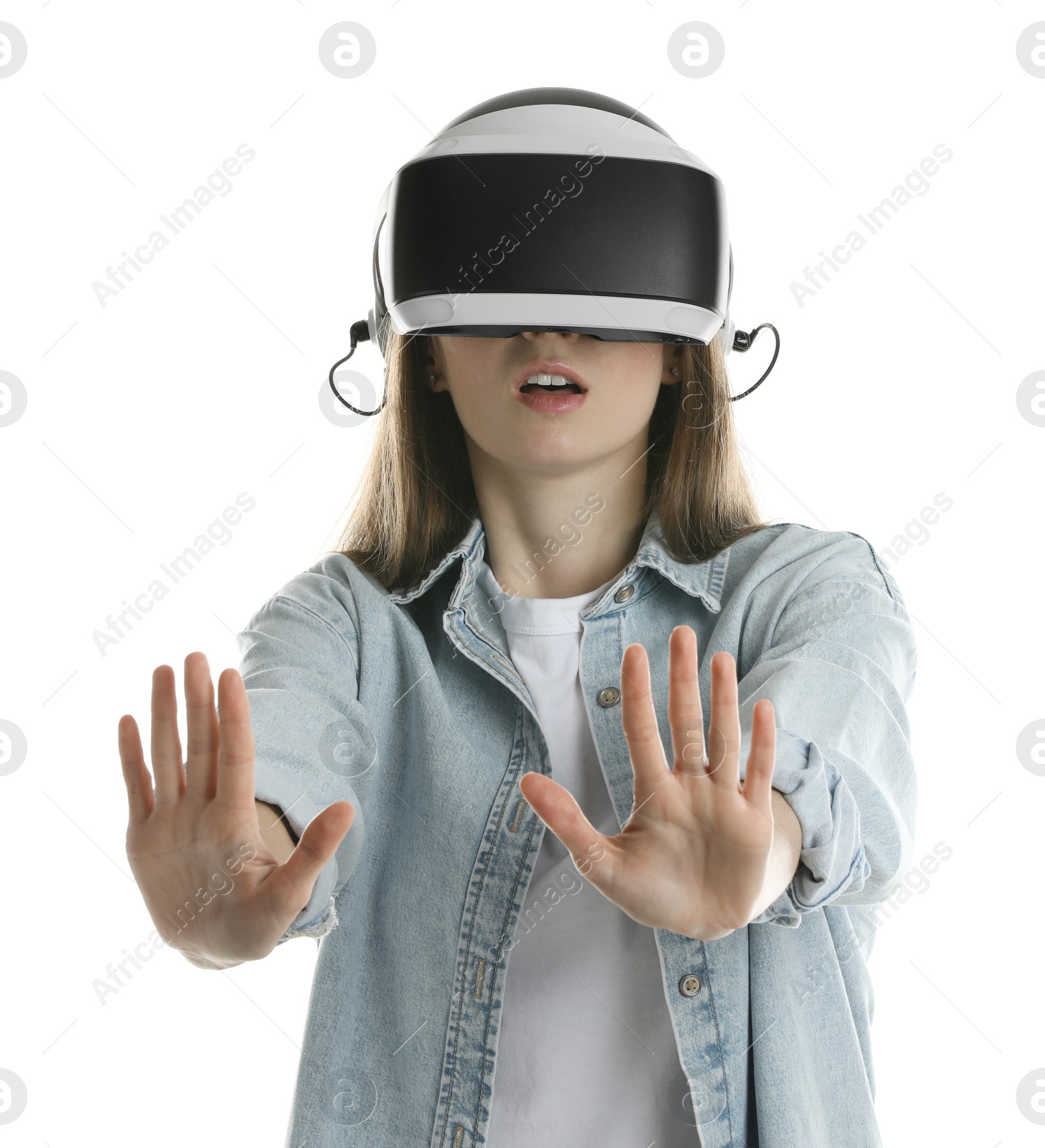 Photo of Surprised woman using virtual reality headset on white background