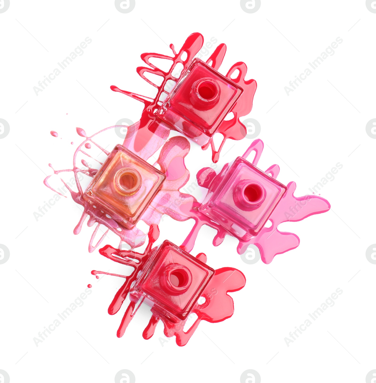 Photo of Many bottles and spilled nail polishes isolated on white, top view
