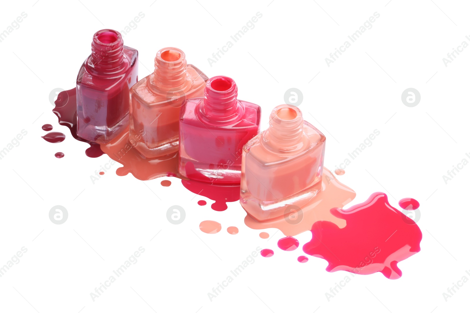 Photo of Many bottles and drops of colorful nail polishes isolated on white