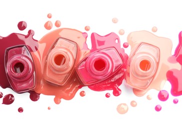 Many bottles and drops of colorful nail polishes isolated on white, top view