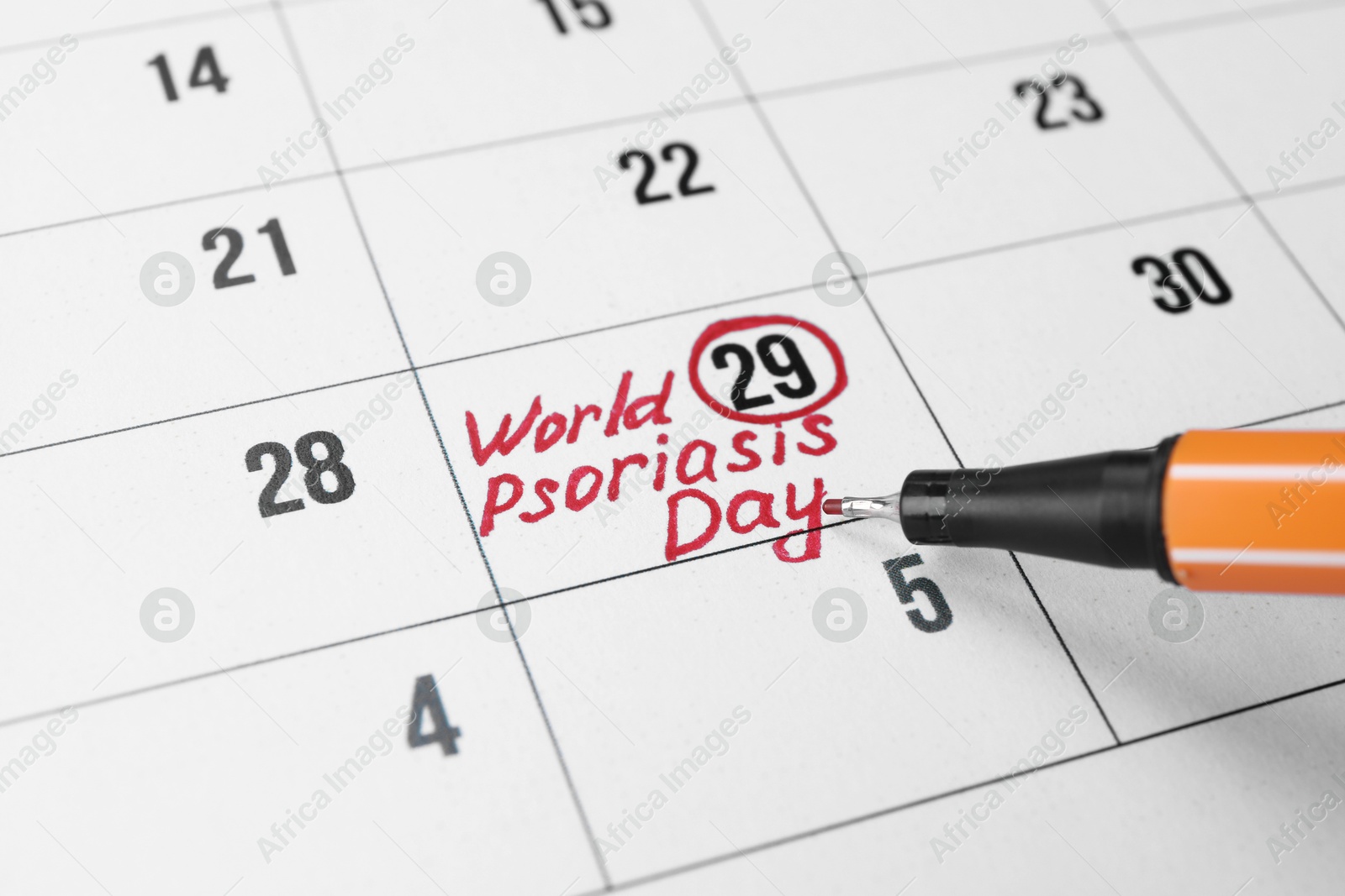 Photo of International Psoriasis Day. Calendar page with marked date and marker, closeup