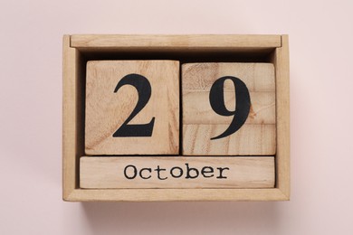 International Psoriasis Day - 29th of October. Block calendar on beige background, top view