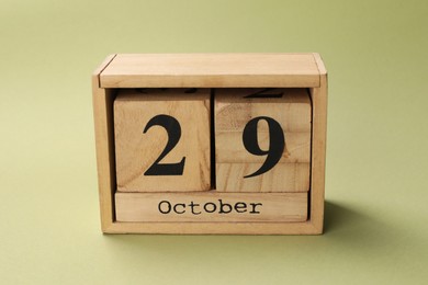 Photo of International Psoriasis Day - 29th of October. Block calendar on green background