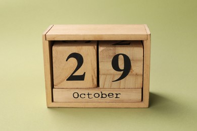 International Psoriasis Day - 29th of October. Block calendar on green background