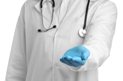 Doctor holding something on white background, closeup