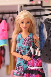 Mykolaiv, Ukraine - September 4, 2023: Beautiful Barbie doll with dress near toy wardrobe