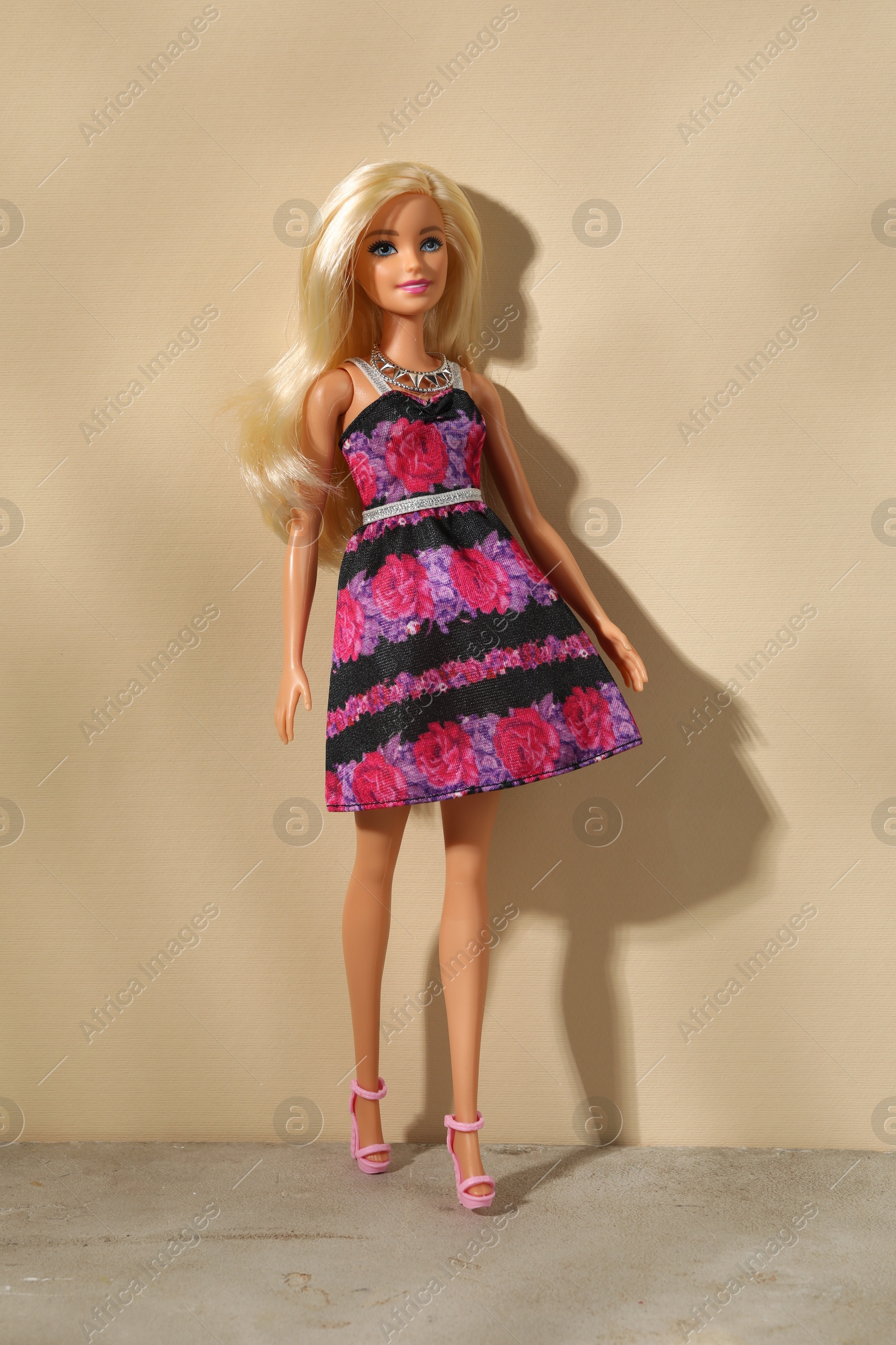 Photo of Mykolaiv, Ukraine - September 4, 2023: Beautiful Barbie doll on beige background