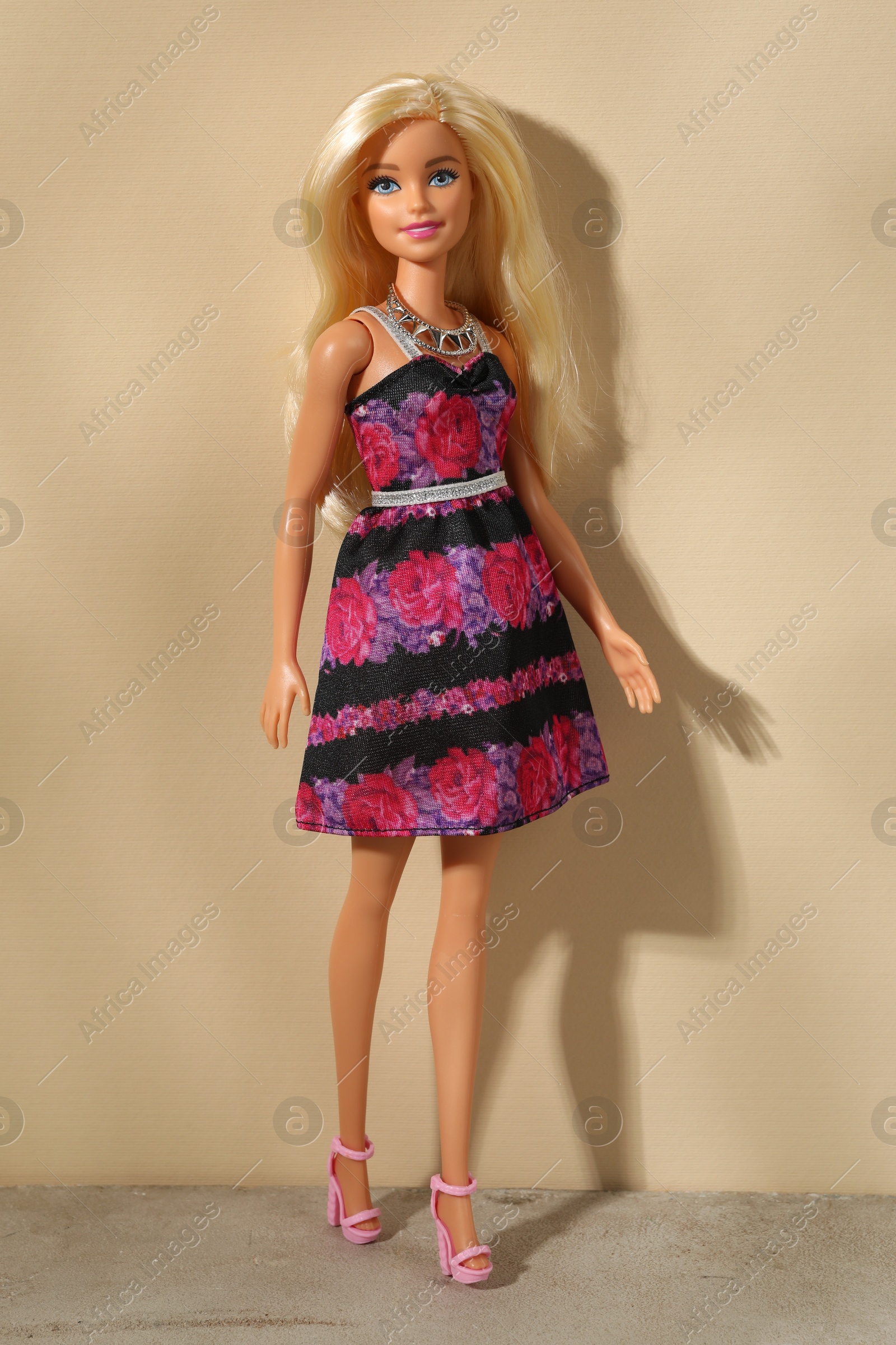 Photo of Mykolaiv, Ukraine - September 4, 2023: Beautiful Barbie doll on beige background