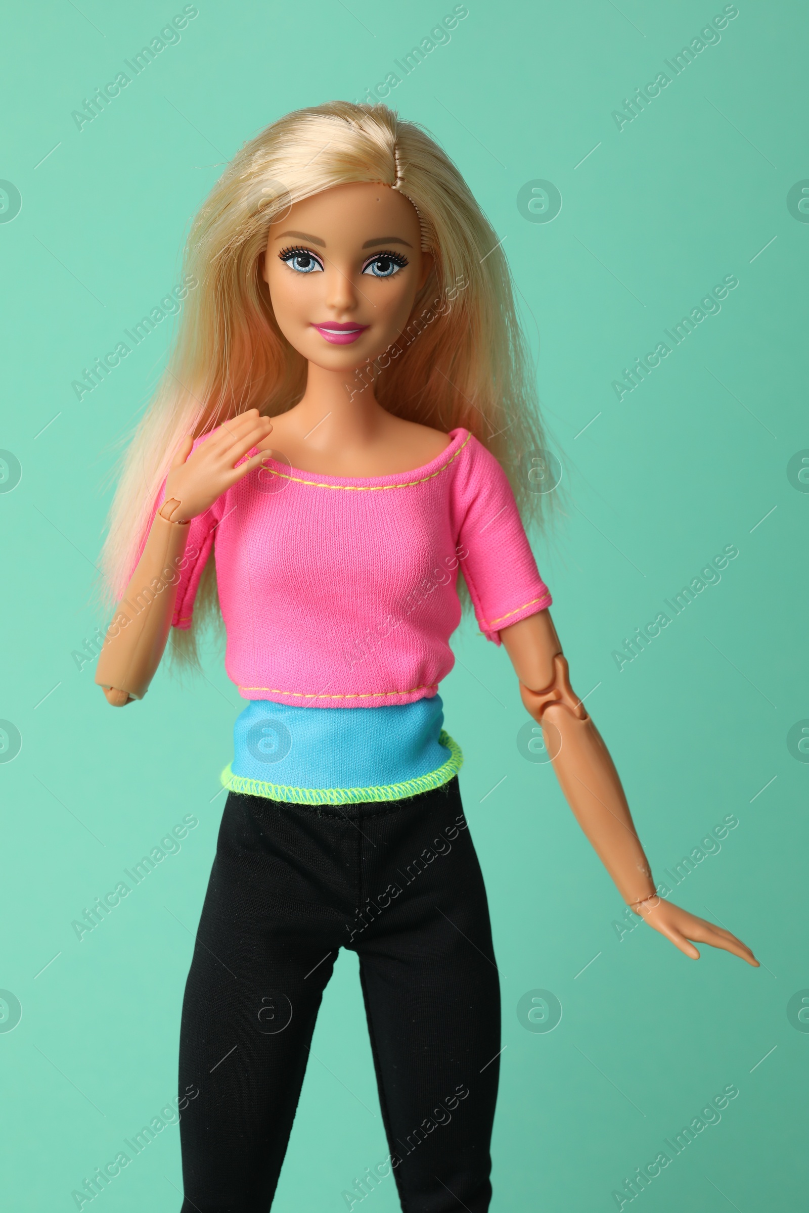 Photo of Mykolaiv, Ukraine - September 2, 2023: Beautiful Barbie doll on turquoise background