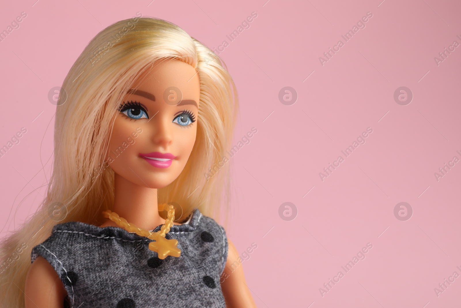 Photo of Mykolaiv, Ukraine - September 2, 2023: Beautiful Barbie doll on pale pink background, space for text