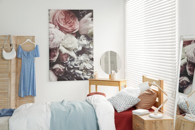 Teen's room interior with modern furniture and beautiful picture on wall
