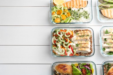 Photo of Healthy meal. Containers with different products on white wooden table, flat lay. Space for text
