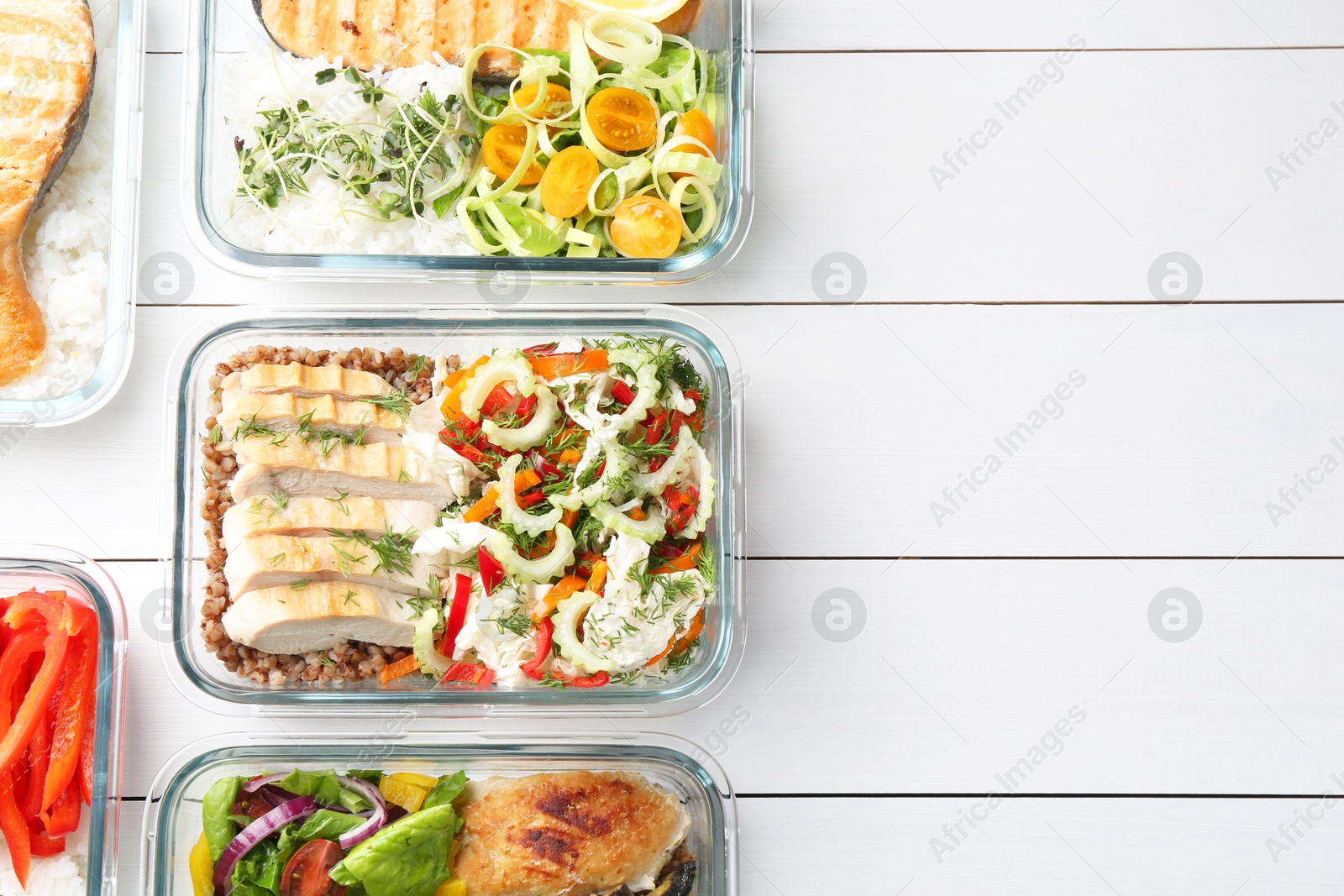 Photo of Healthy meal. Containers with different products on white wooden table, flat lay. Space for text