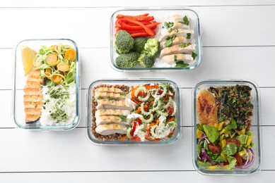 Photo of Healthy meal. Containers with different products on white wooden table, flat lay