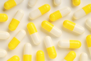 Many antibiotic pills on white background, top view