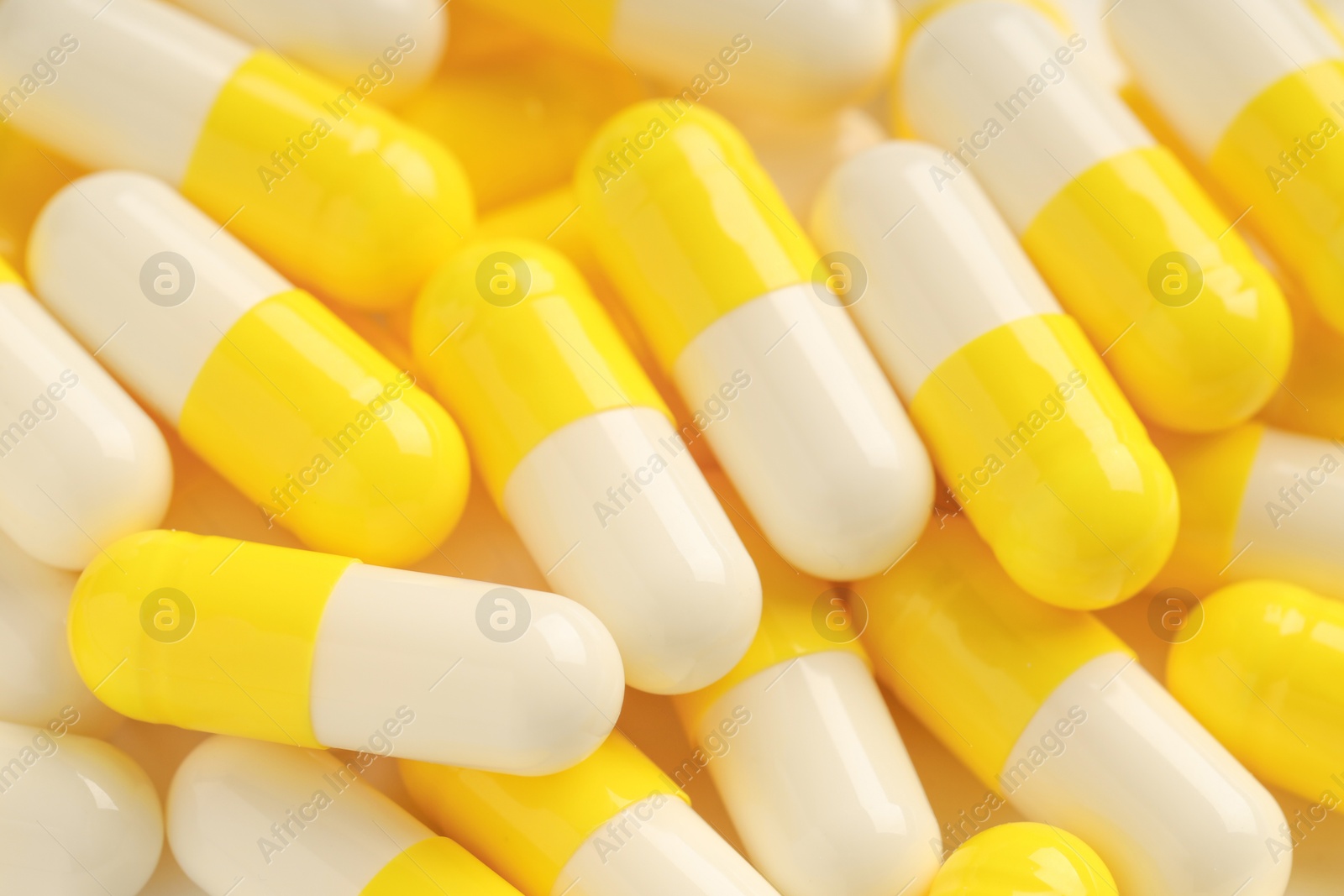 Photo of Many antibiotic pills as background, closeup. Medicinal treatment