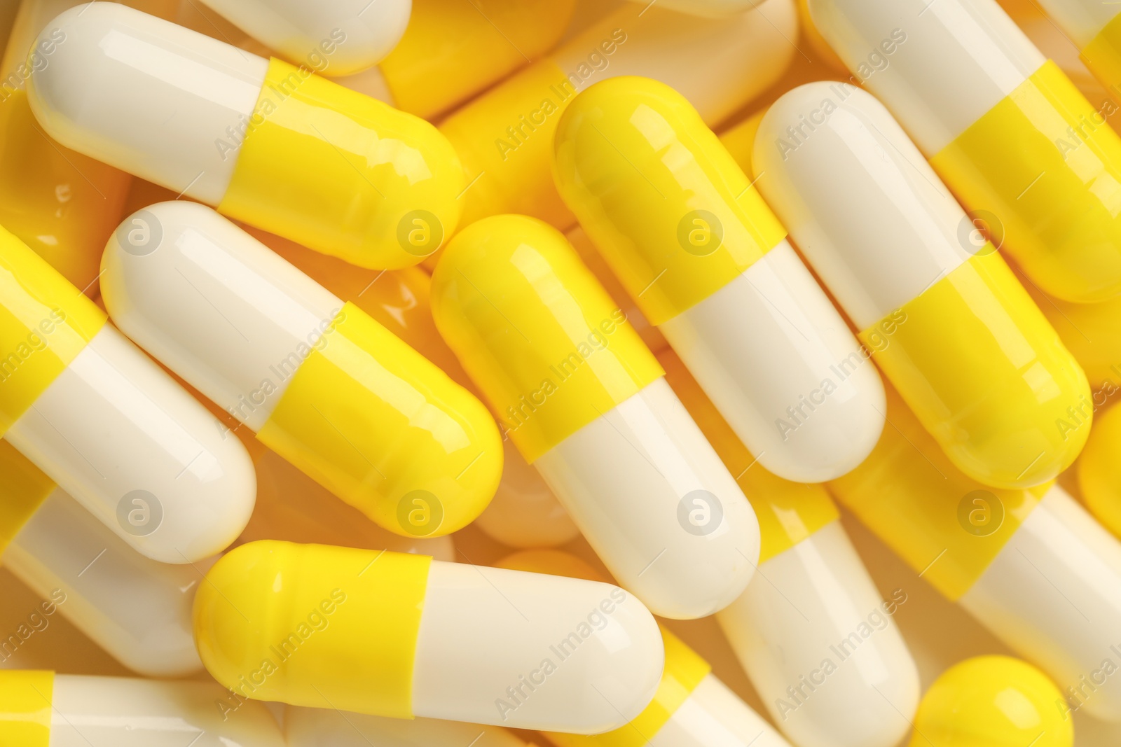 Photo of Many antibiotic pills as background, top view