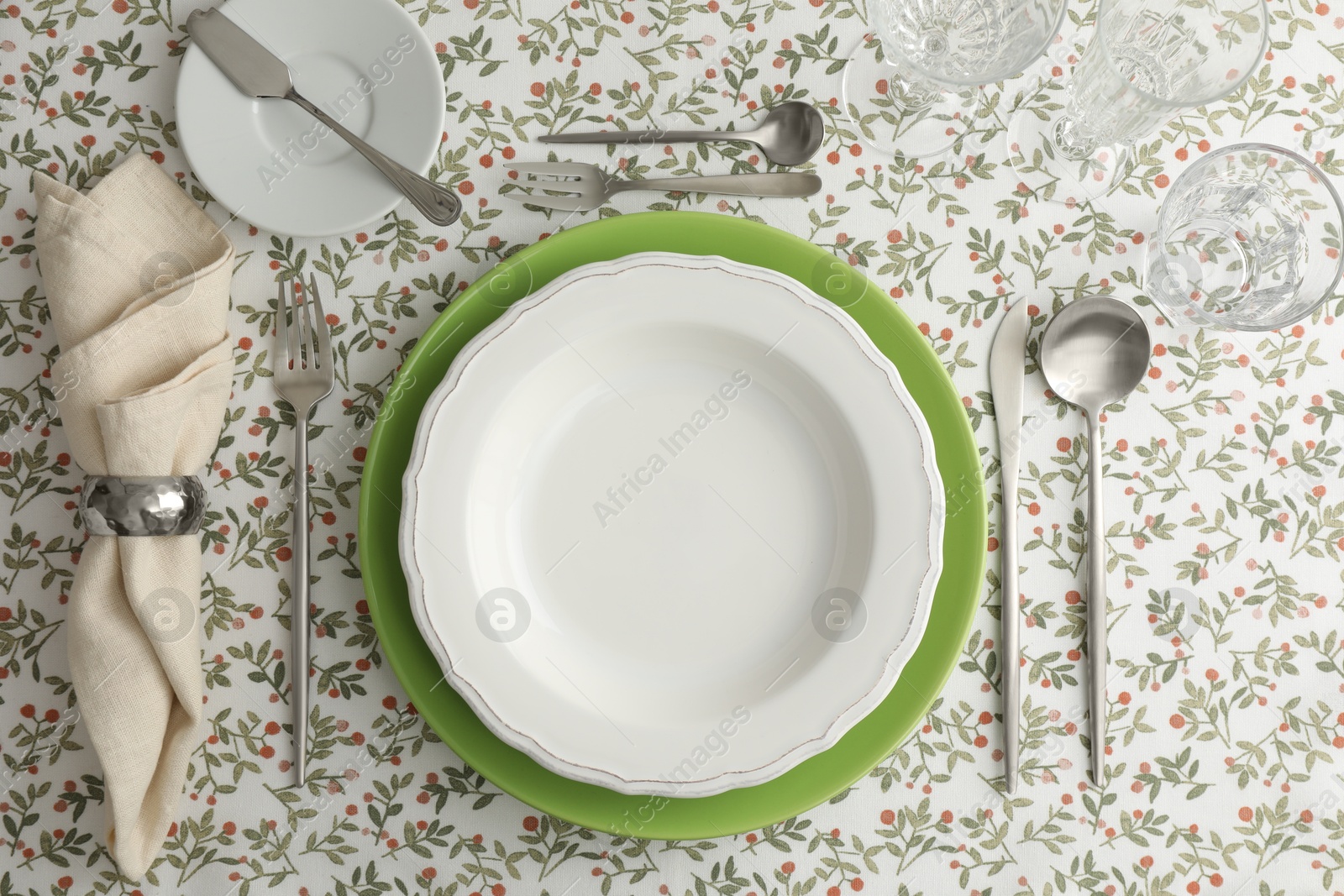 Photo of Stylish setting with cutlery, plates, napkin and glasses on table, flat lay