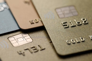 Photo of Different plastic credit cards as background, macro view