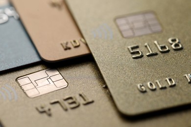 Different plastic credit cards as background, macro view