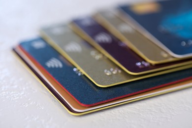 Plastic credit cards on table, closeup view