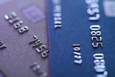 Two plastic credit cards as background, macro view