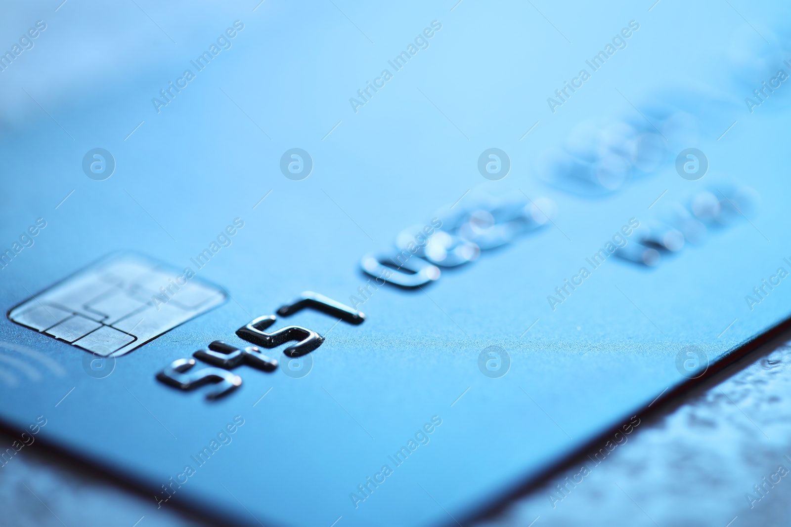 Photo of Plastic credit card on table, macro view