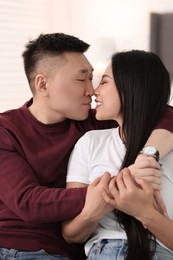 Photo of Portrait of lovely young couple at home