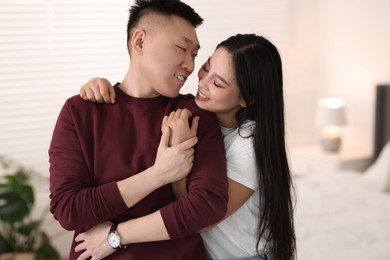 Photo of Portrait of lovely young couple at home