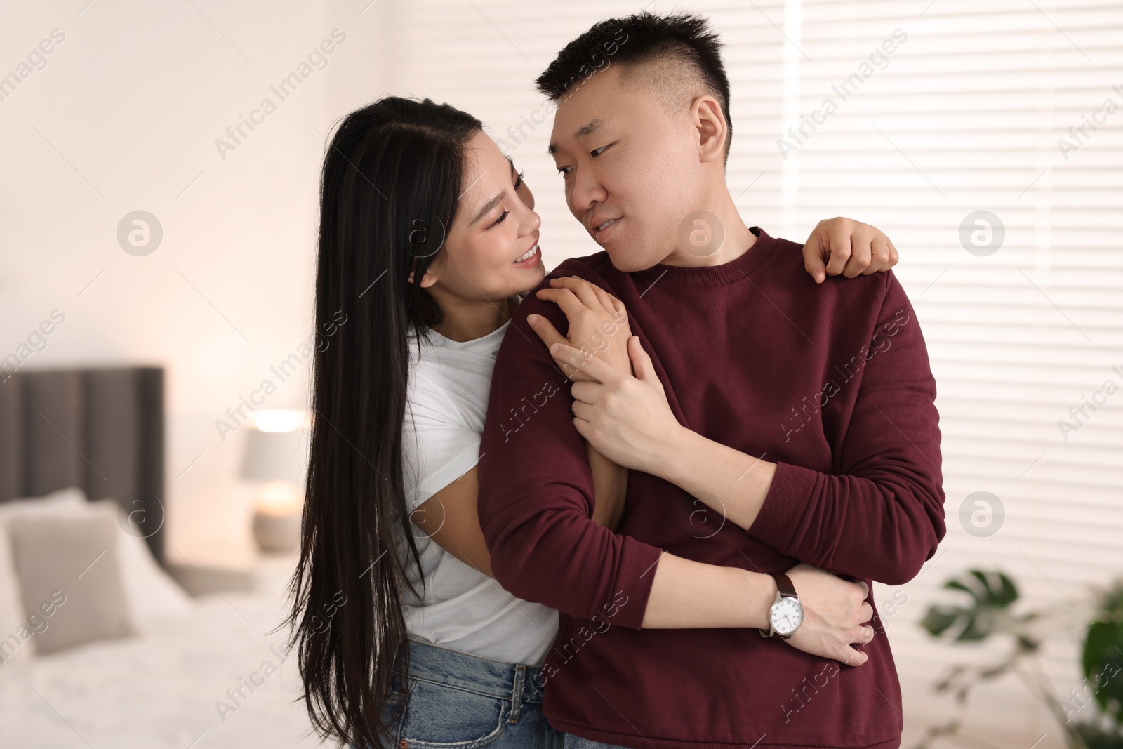 Photo of Portrait of lovely young couple at home