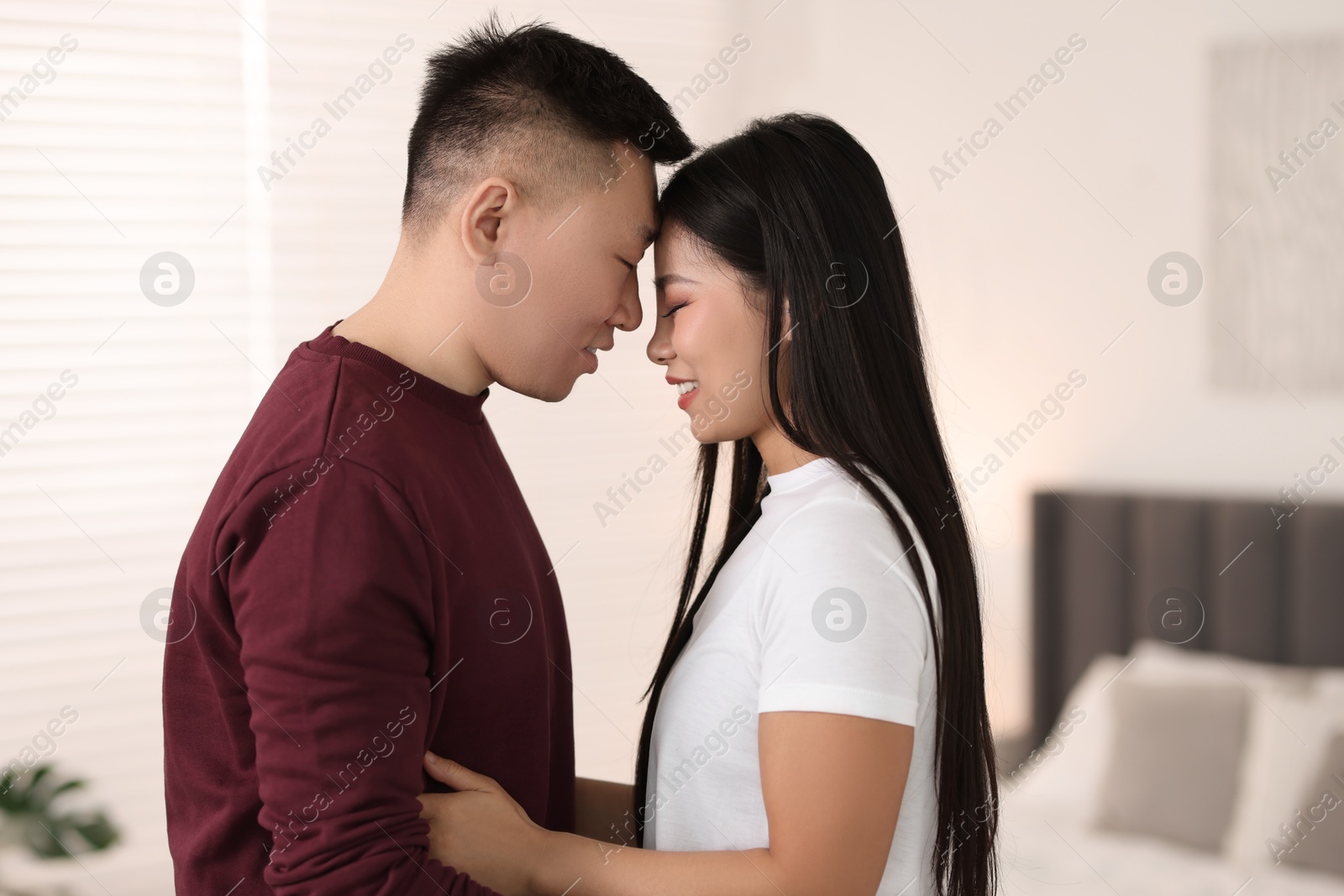 Photo of Portrait of lovely young couple at home