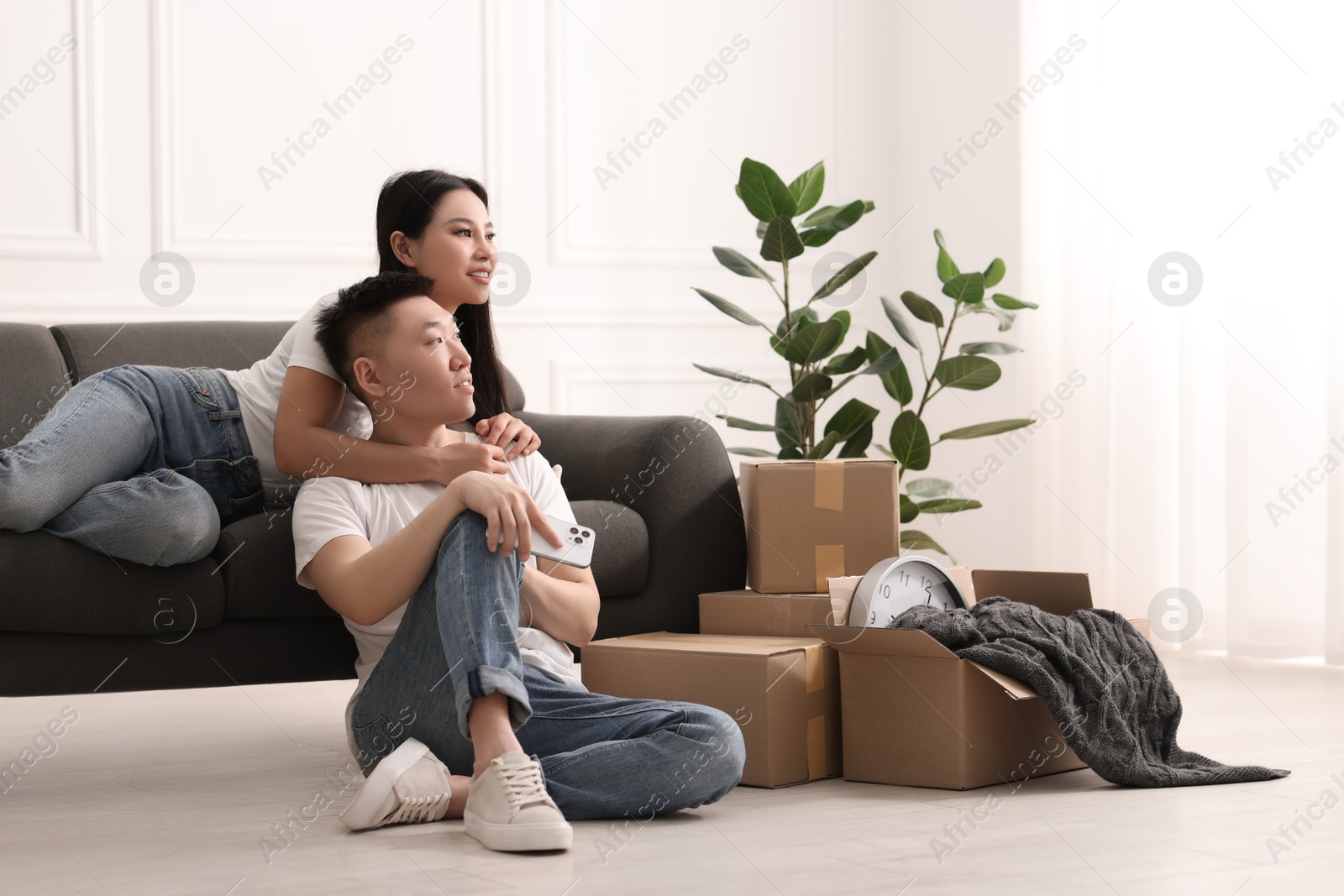 Photo of Happy young couple in their new apartment