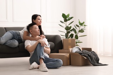 Happy young couple in their new apartment