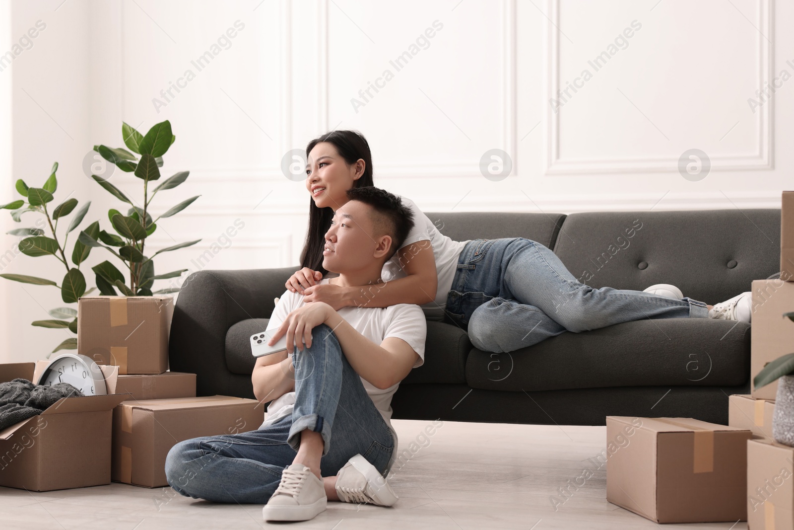Photo of Happy young couple in their new apartment