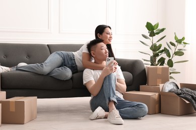 Photo of Happy young couple in their new apartment