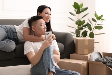 Happy young couple in their new apartment