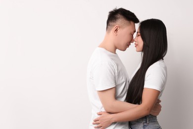 Photo of Portrait of happy couple on white background, space for text