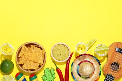 Flat lay composition with Mexican sombrero hat on yellow background, space for text