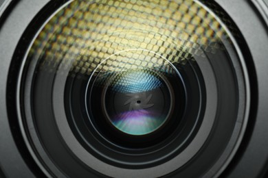 Photo of Lens of professional camera, closeup. Photographer's equipment