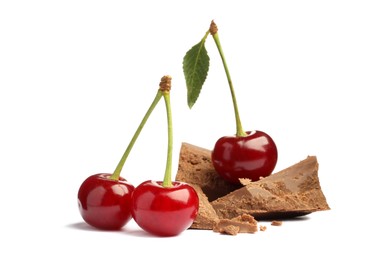 Fresh cherries with pieces of milk chocolate isolated on white