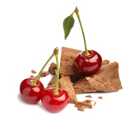 Fresh cherries with pieces of milk chocolate isolated on white