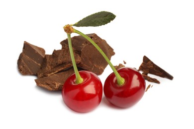 Fresh cherries with pieces of dark chocolate isolated on white