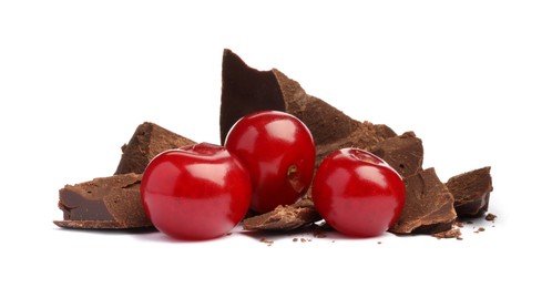 Fresh cherries with pieces of dark chocolate isolated on white