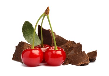 Fresh cherries with pieces of dark chocolate isolated on white