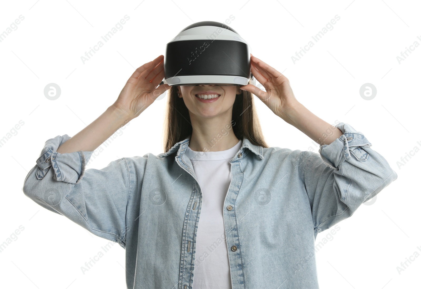 Photo of Smiling woman using virtual reality headset on white background