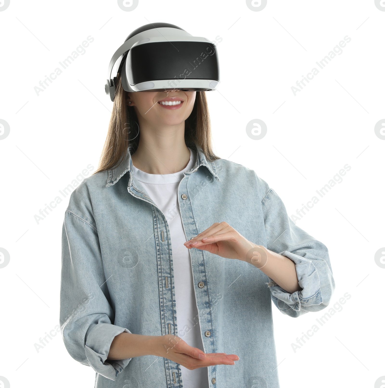 Photo of Smiling woman using virtual reality headset on white background